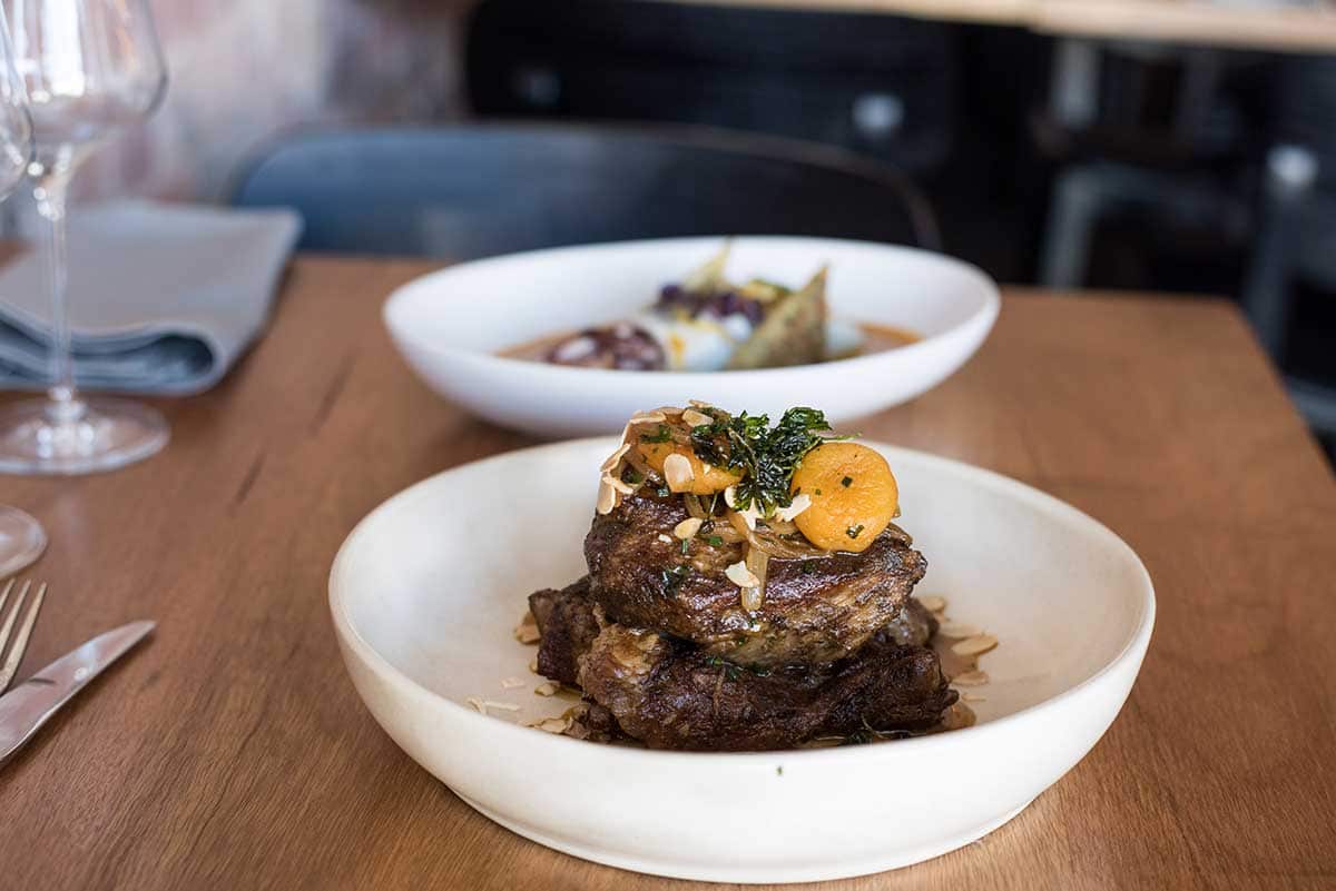 slow cooked goat dish, served with caramelised onions, apricot and pomegranate