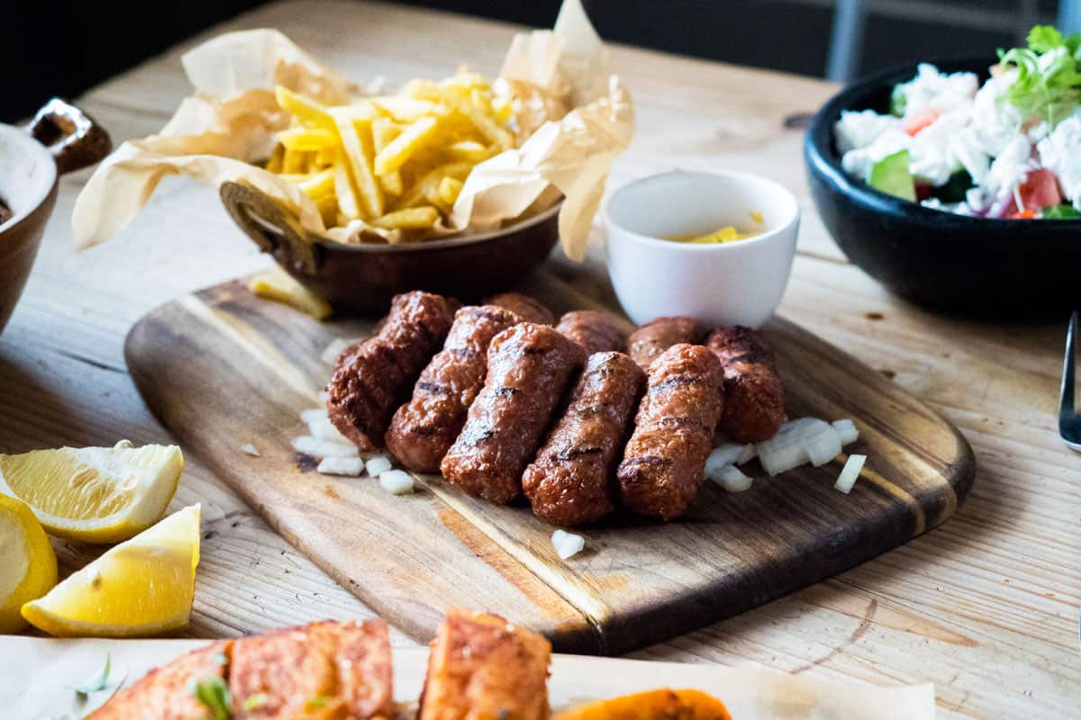 The grilled skinless sausage cevapi or ćevapčići comes in traditional or slider form.