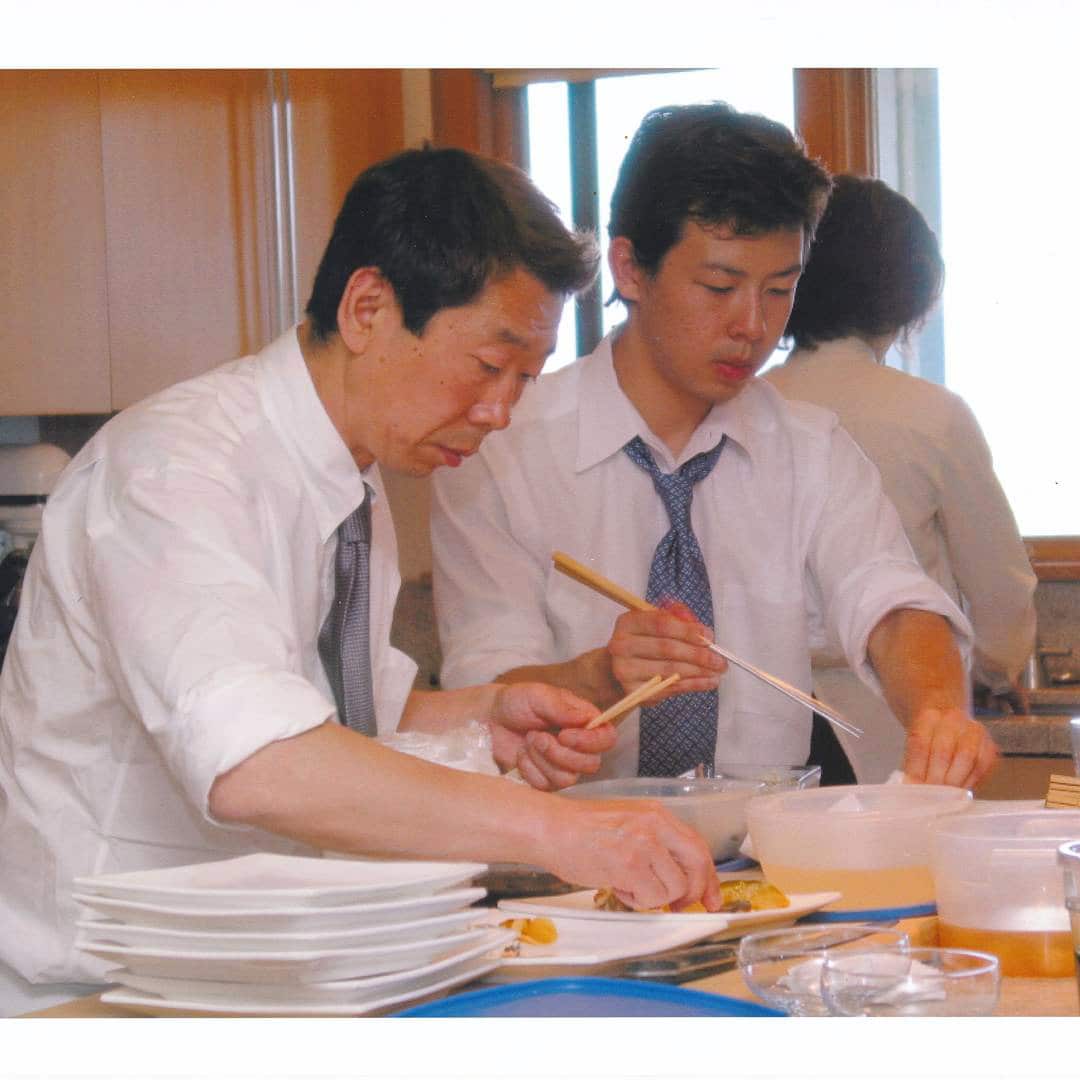 Chase Kojima cooking with his father.