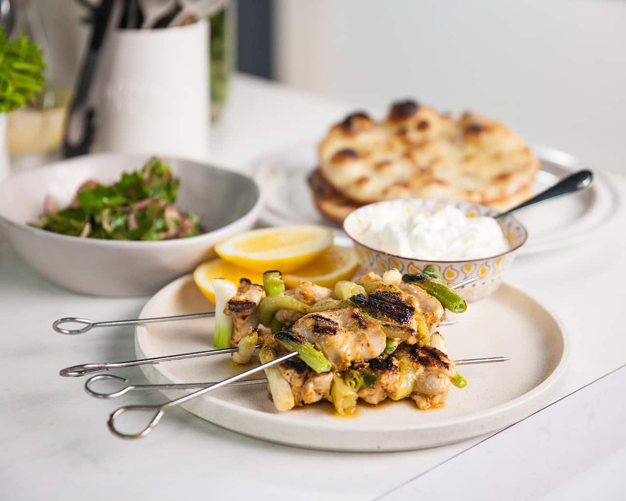 Chicken shawarma with puffed pita and pickled onion salad