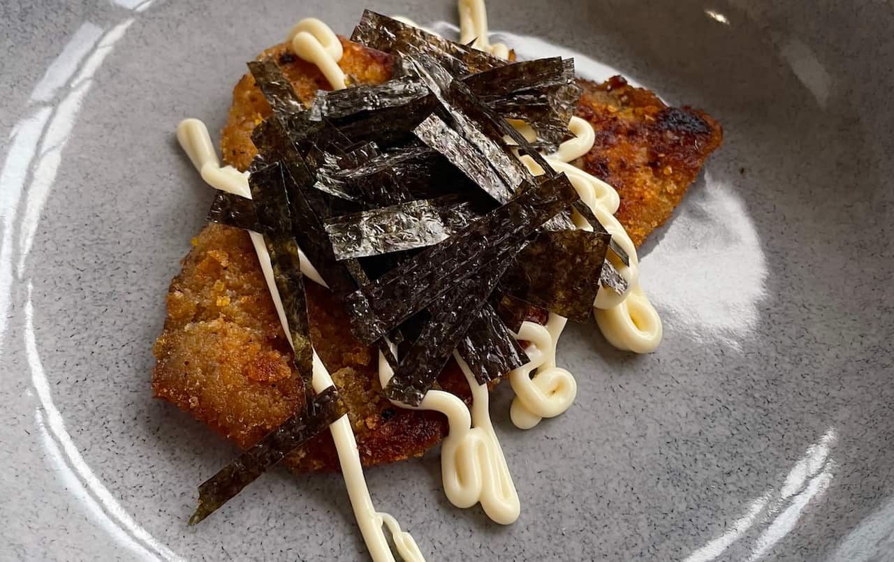 Chicken schnitzel with seaweed and Japanese mayonnaise. 