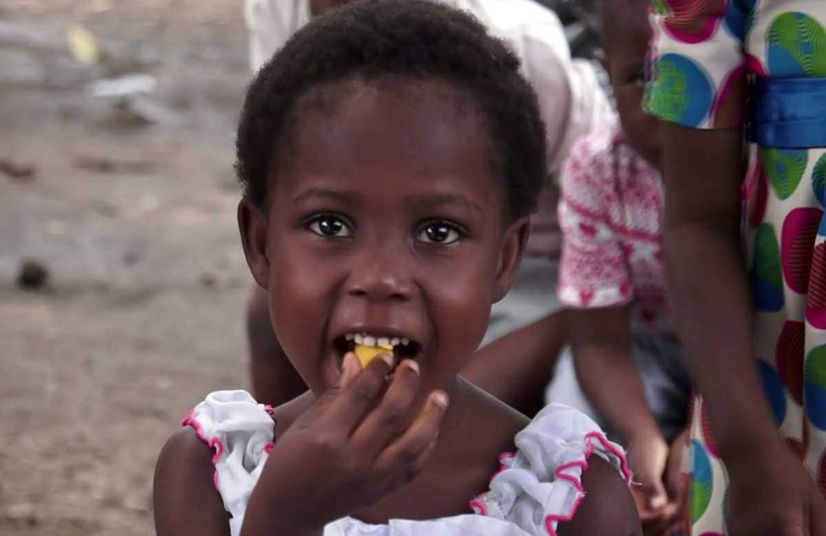 Child eating at Ivory Coast wedding