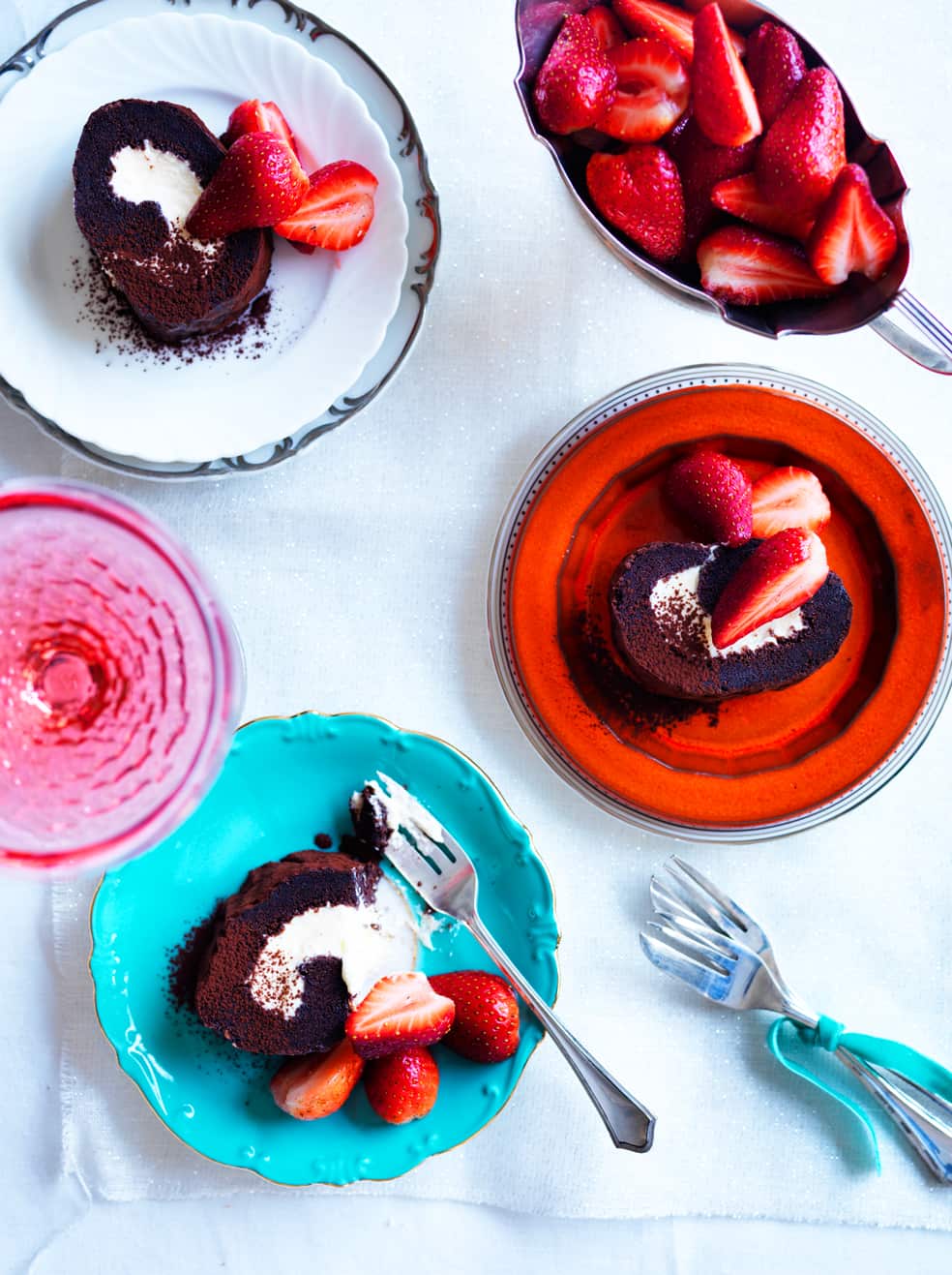Chocolate roulade with brandy-soaked strawberries and marzipan cream