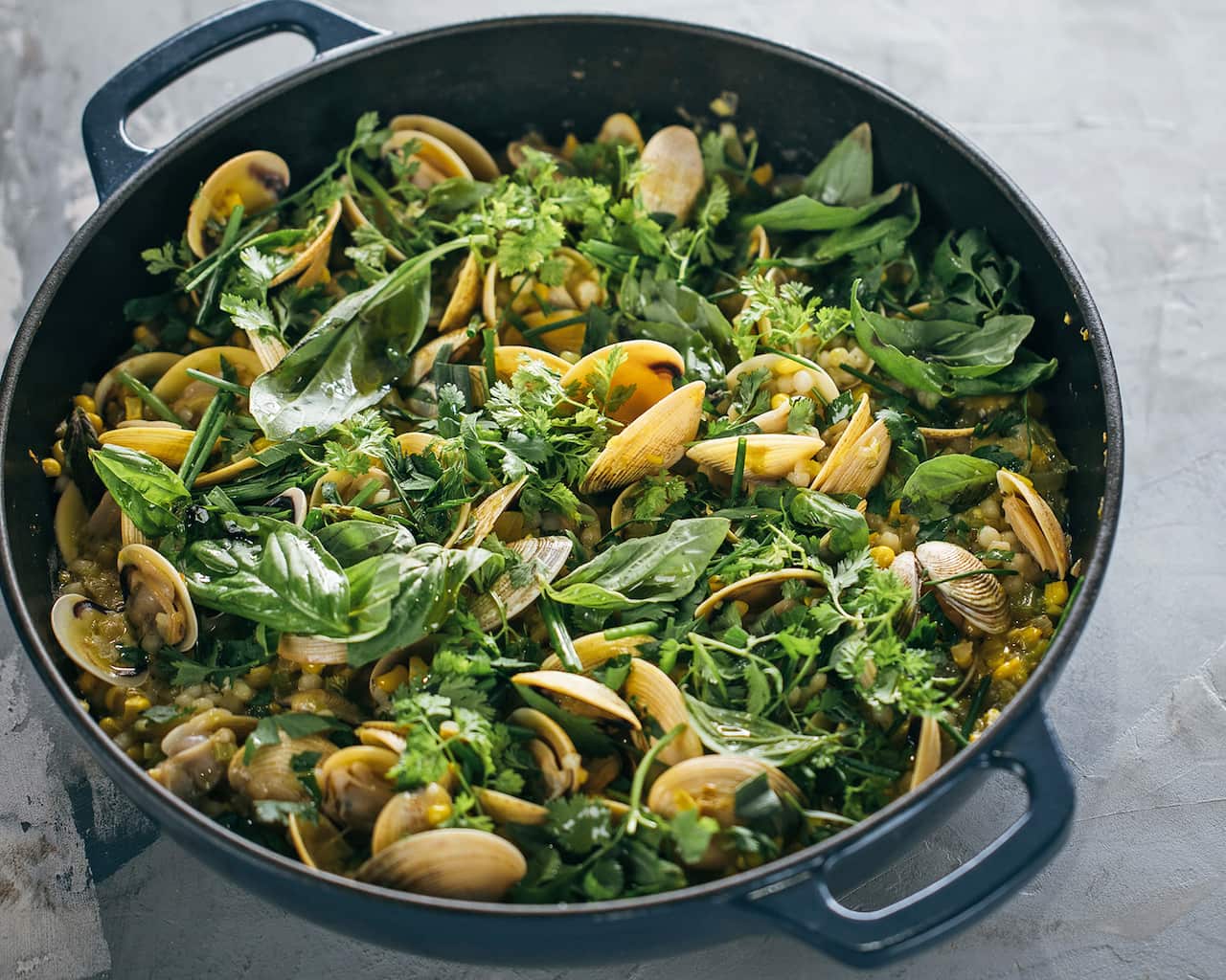 Clams with corn, fregola and herbs