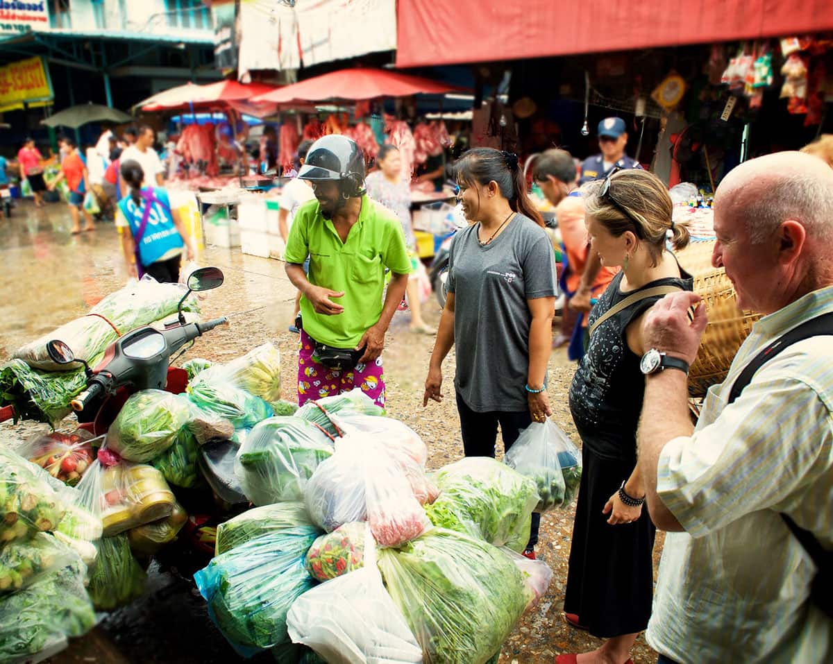 Saiyuud “Poo” Diwong with a vegetable delivery