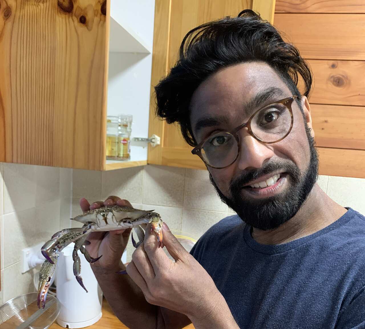 Suren Jayemanne prepares to cook crab curry.