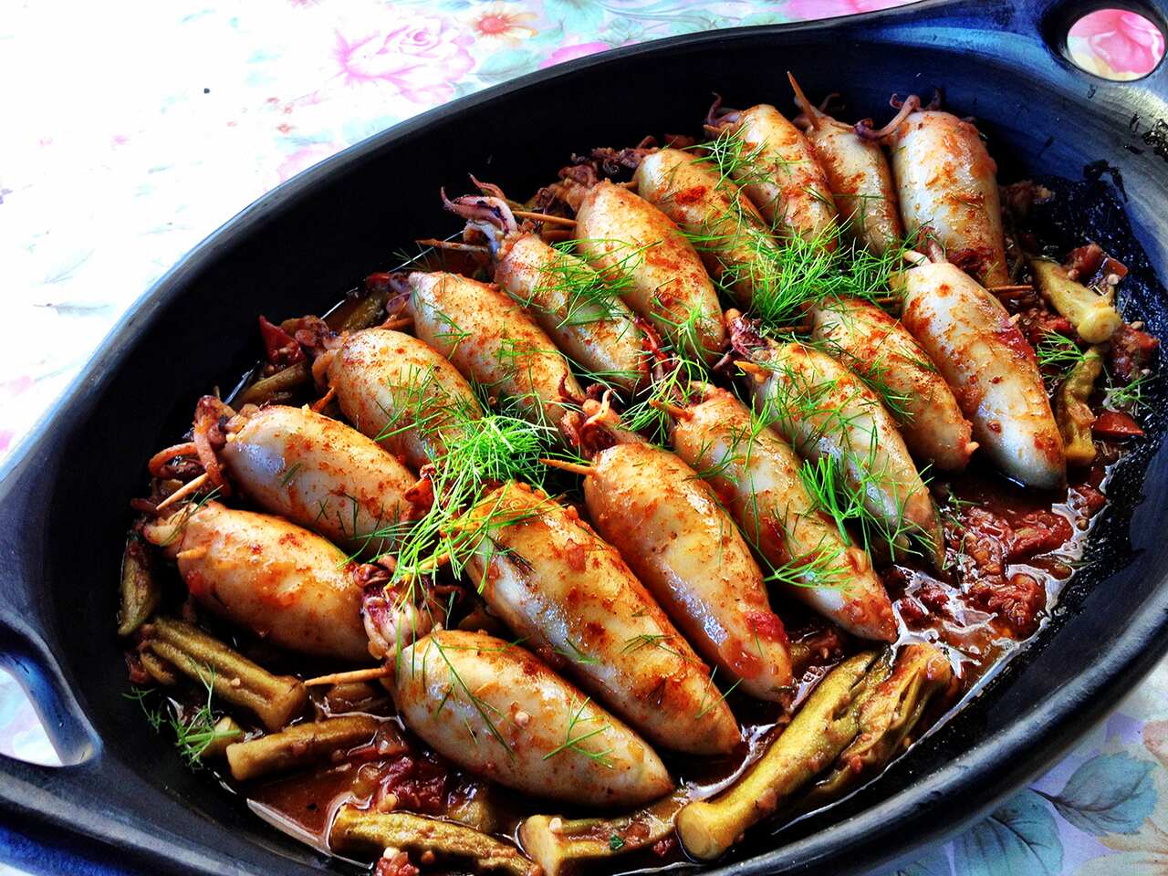 Bulgur-stuffed squid with tomato and okra
