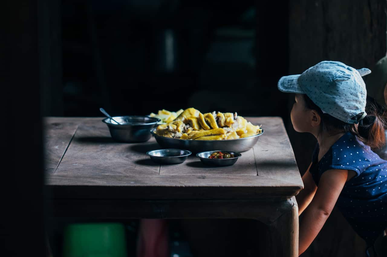 Adam's daughter Anna inspects the Wenchang chicken before it goes out to the family table. Destination Flavour China