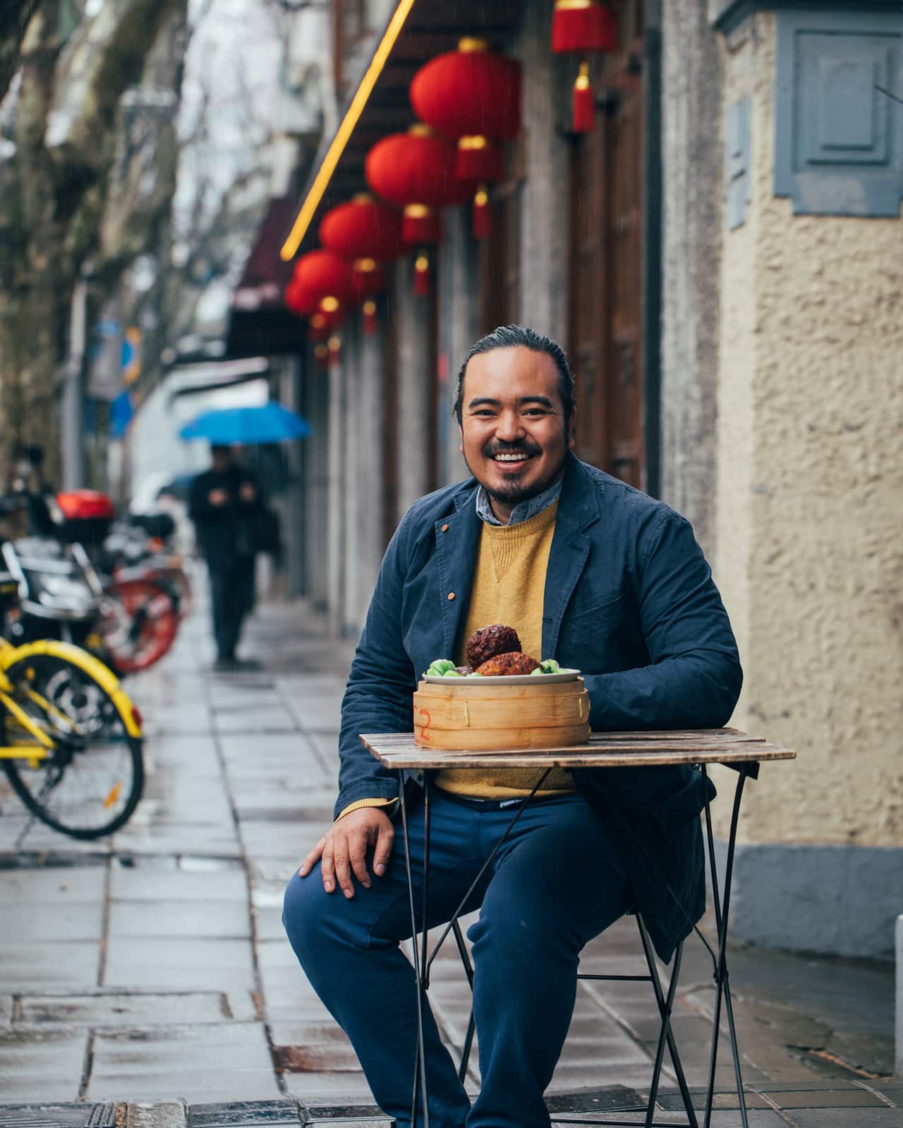 Adam on the streets of Shanghai diving into Lion head meatballs. Destination Flavour China