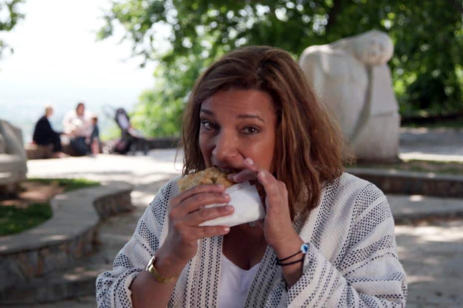 Diane Kochilas eats spanakopita in Greece