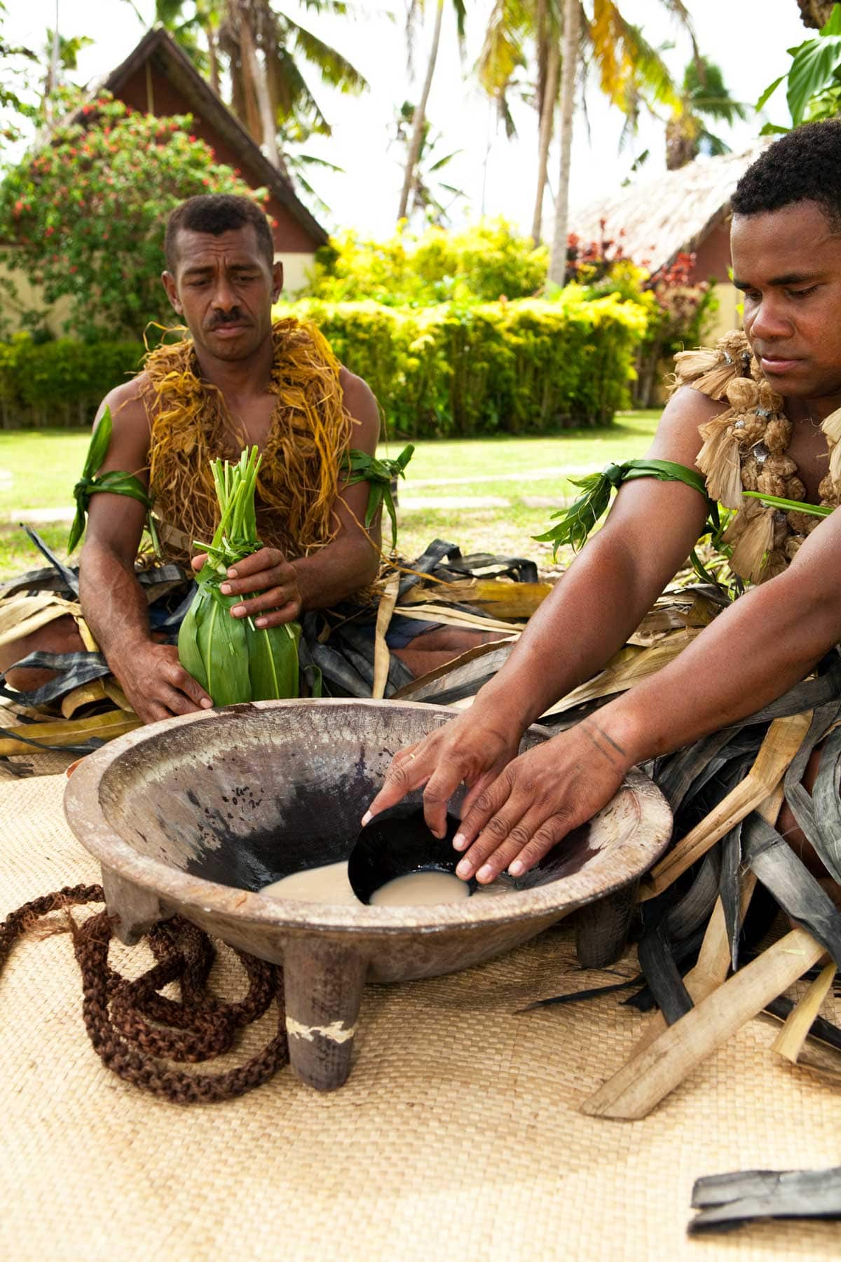 Fijian men preparing kava in the traditional style.
