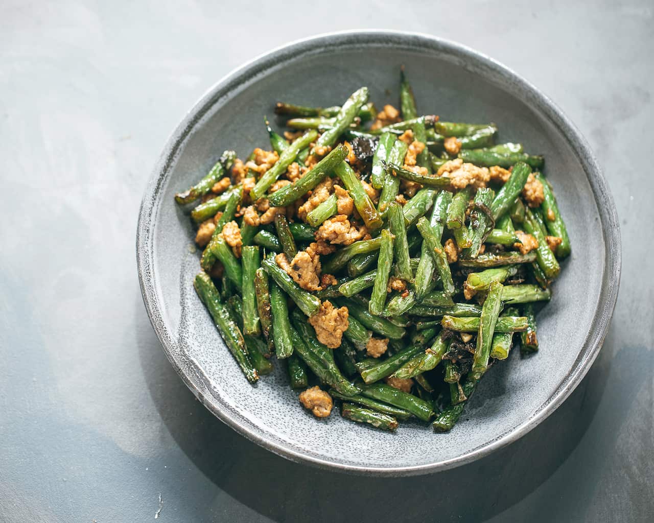 Dry-fried green beans with pork and Chinese olive