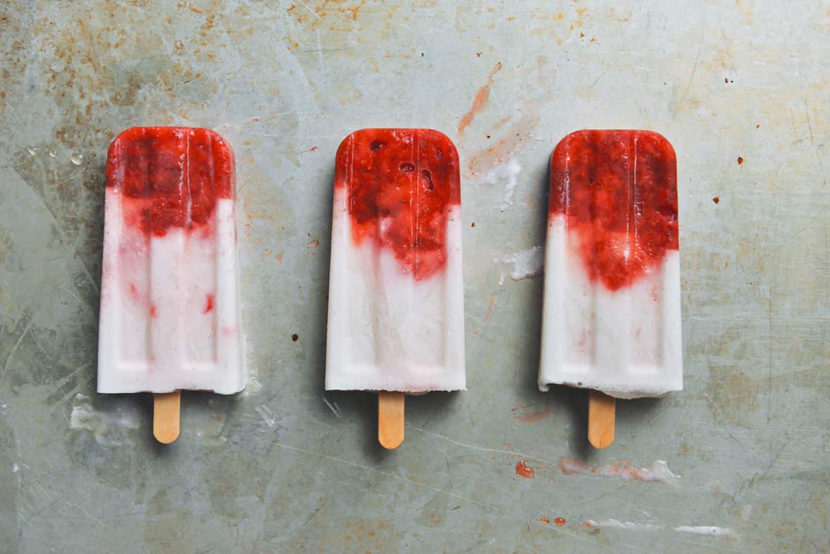 Coconut, lime and strawberry popsicles