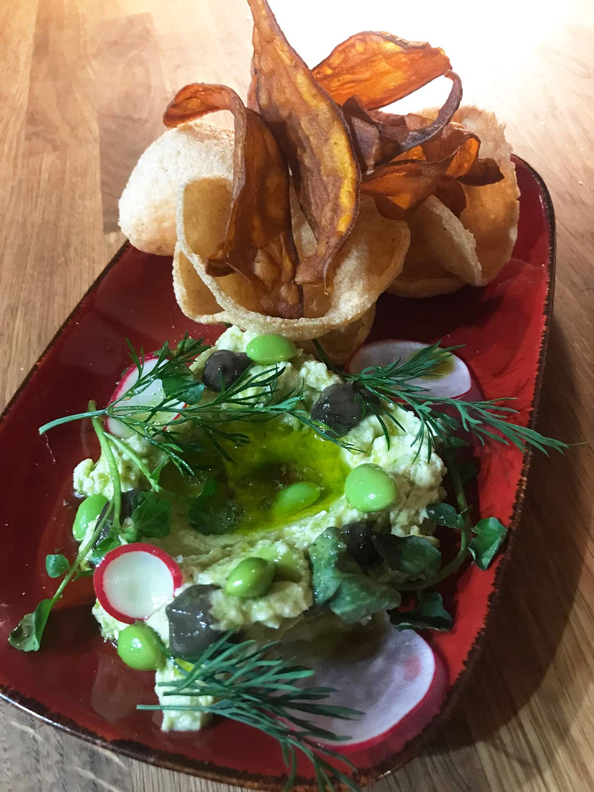 Edamame hummus arrives with prawn crackers.