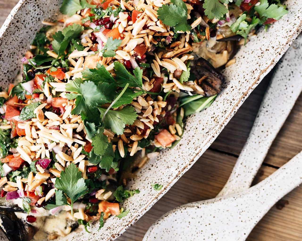 Eggplant with tahini, pomegranate and tomato salsa