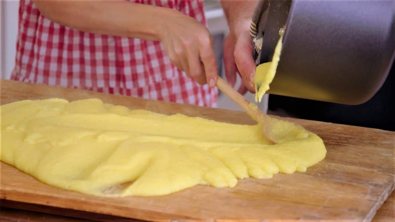 Spreading polenta on board