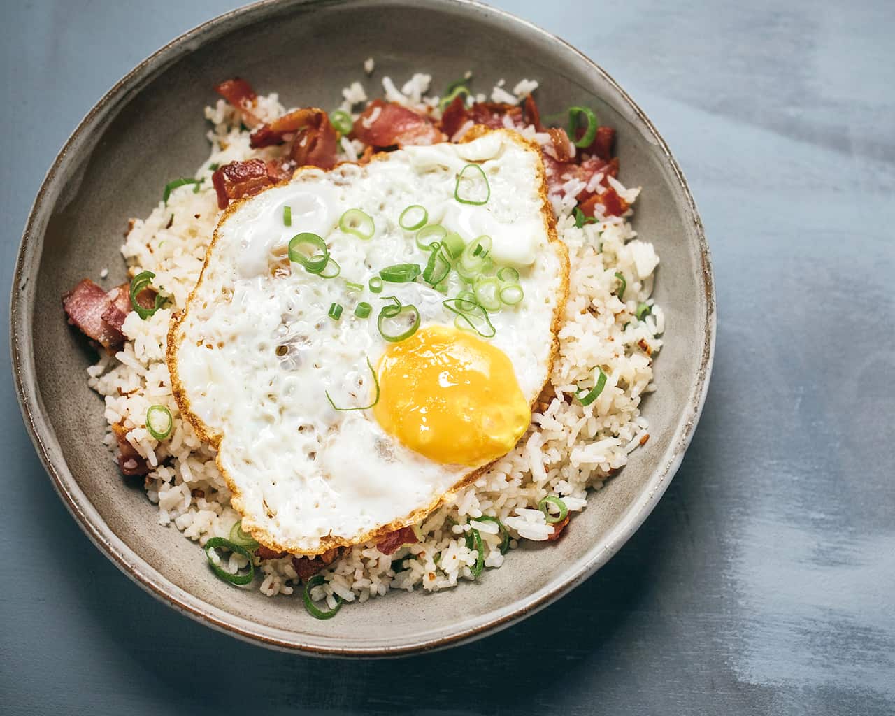 Filipino garlic fried rice with bacon and egg