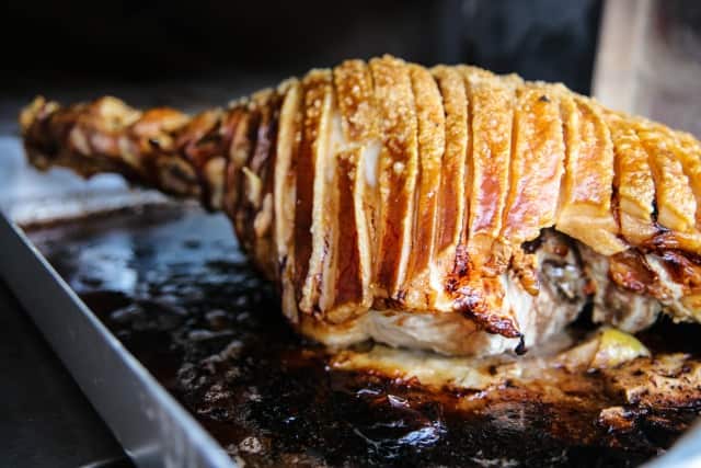 Wood-roasted free range Wessex saddleback pork leg with darkened