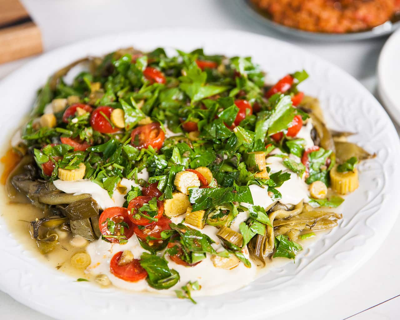 Ful medames (slow-cooked broad beans with tarator, dill and pickled cucumbers)