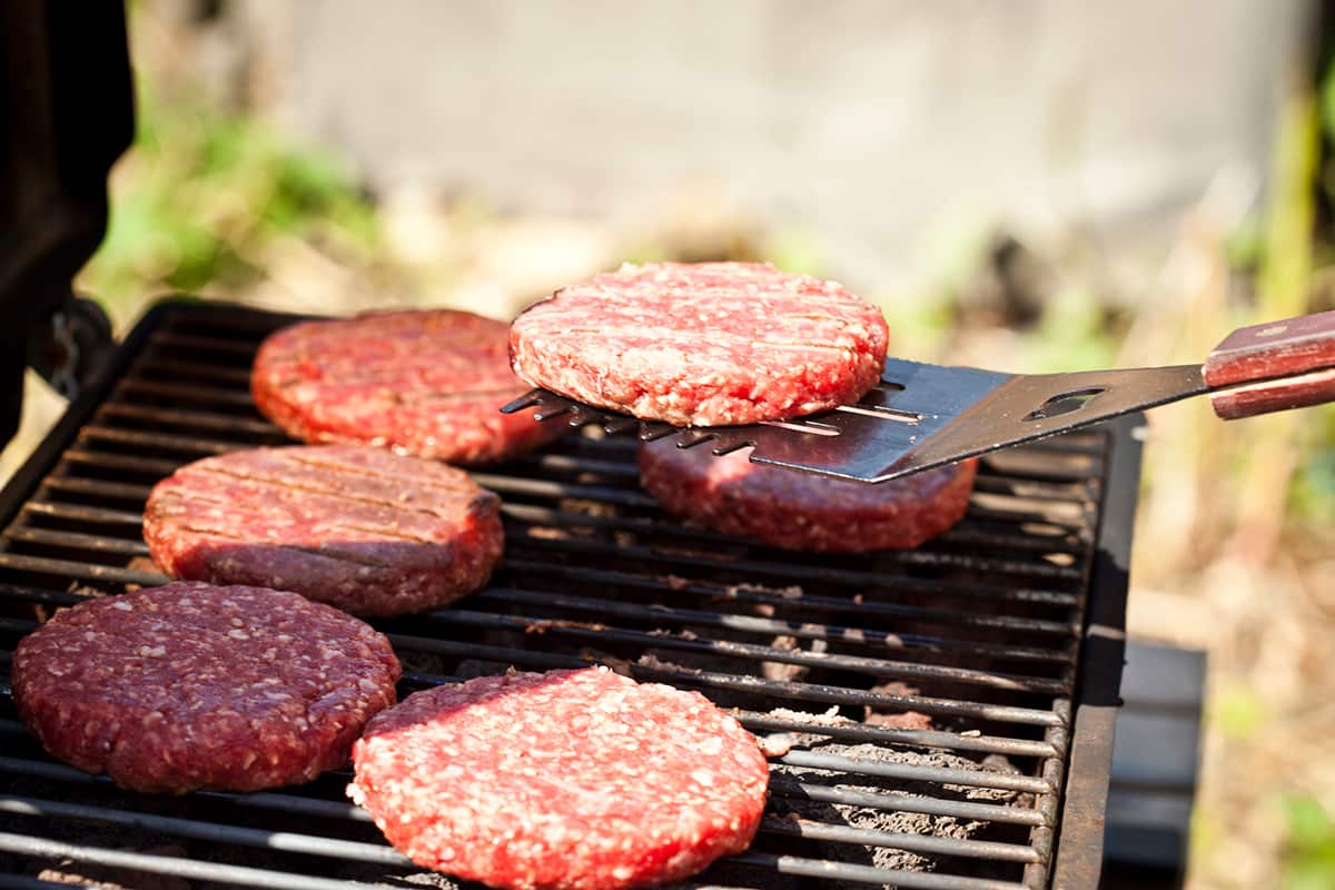 Cooking burgers on barbecue