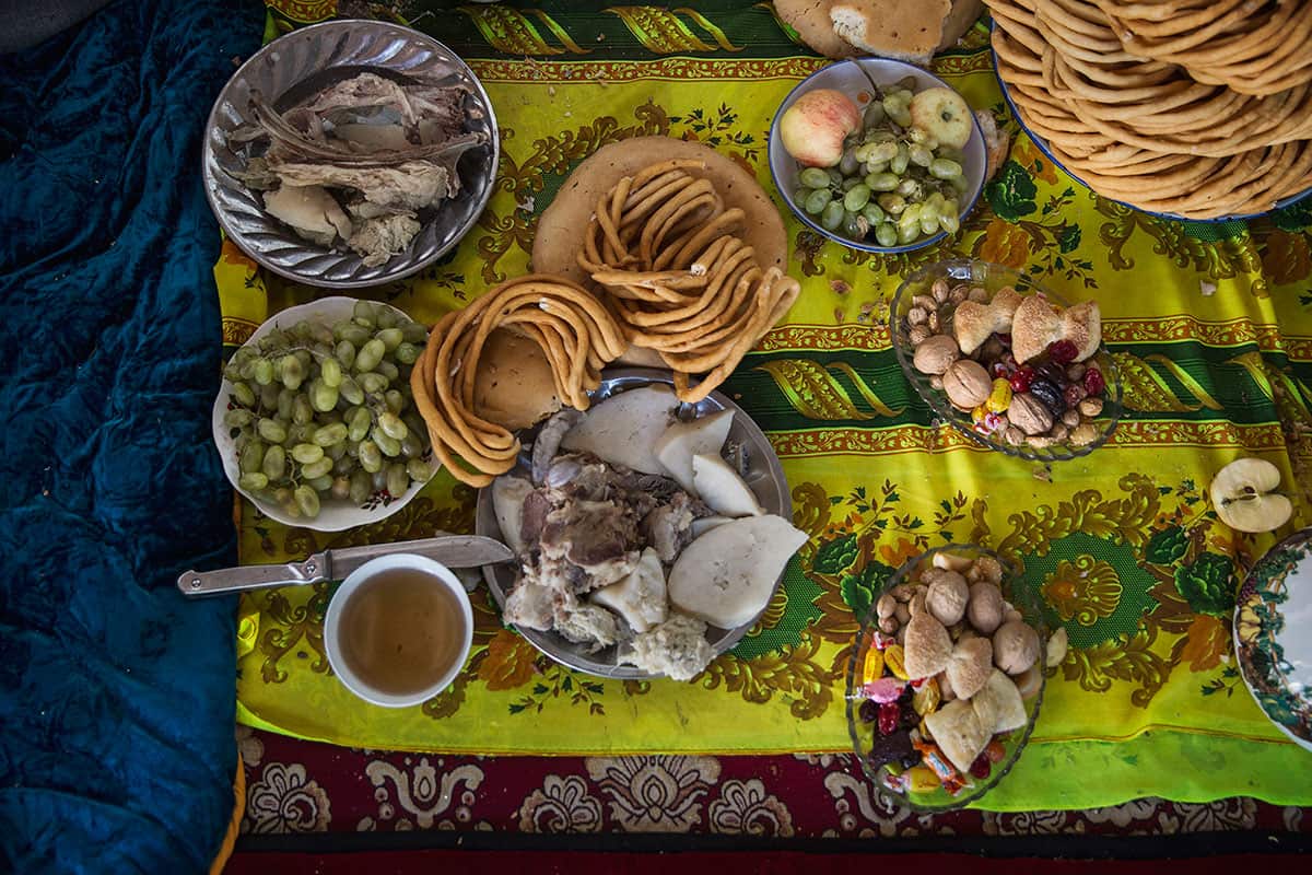 Uyghur family meal during the Corban Festival on September 12, 2016 in Turpan County, in the far western Xinjiang province, China. 