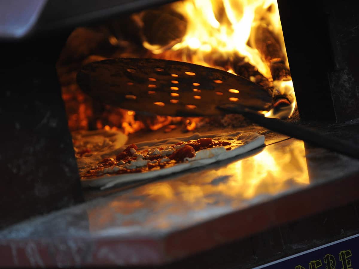 pizza baking in an oven in Naples