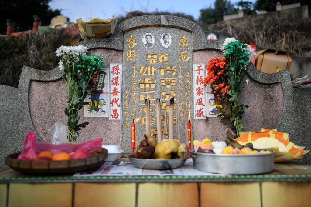 During the Qingming festival, also known as Tomb Sweeping Day, people tend the graves of their departed loved ones, burn goods and offer foods.