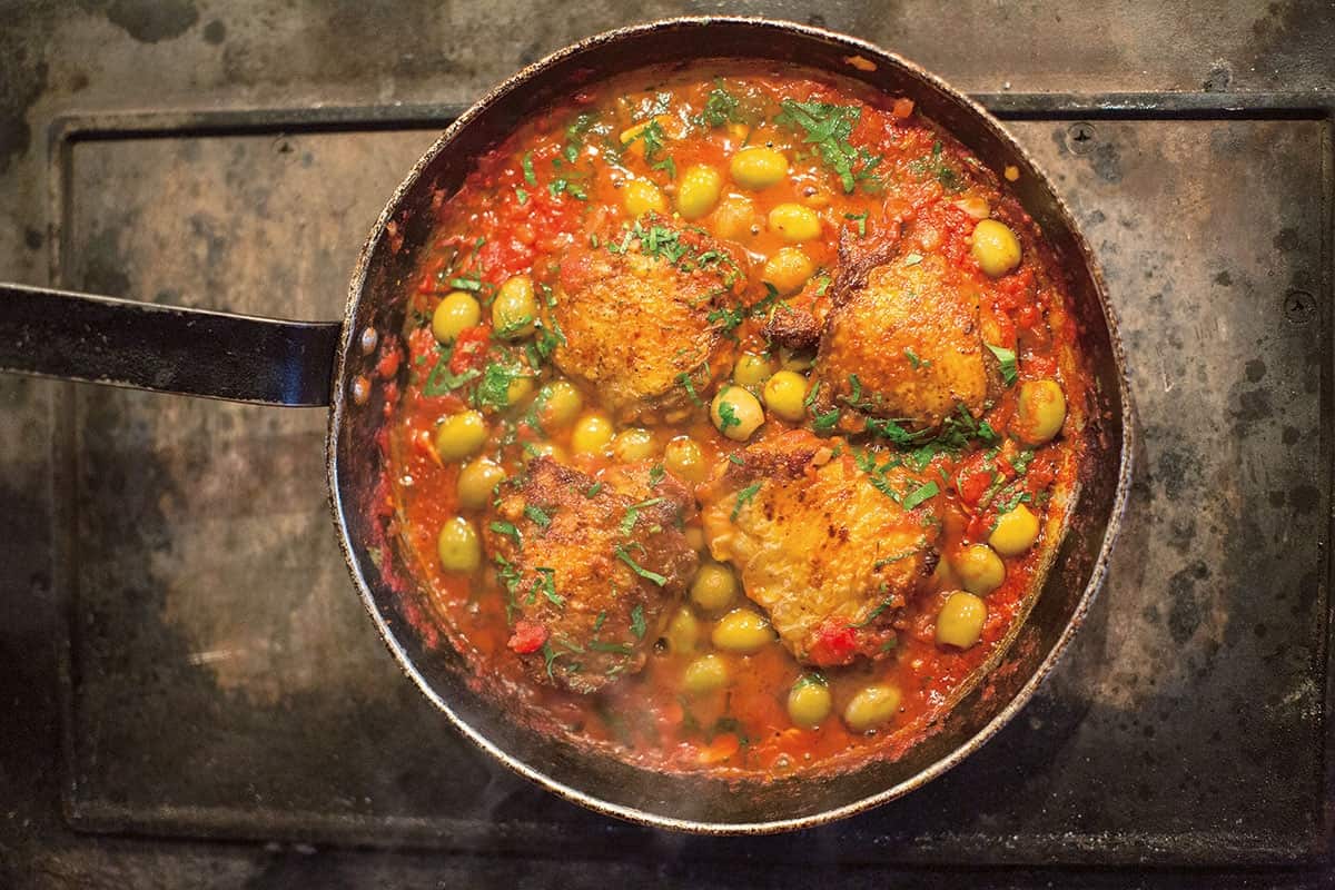 Chicken thighs in green olive and tomato sauce