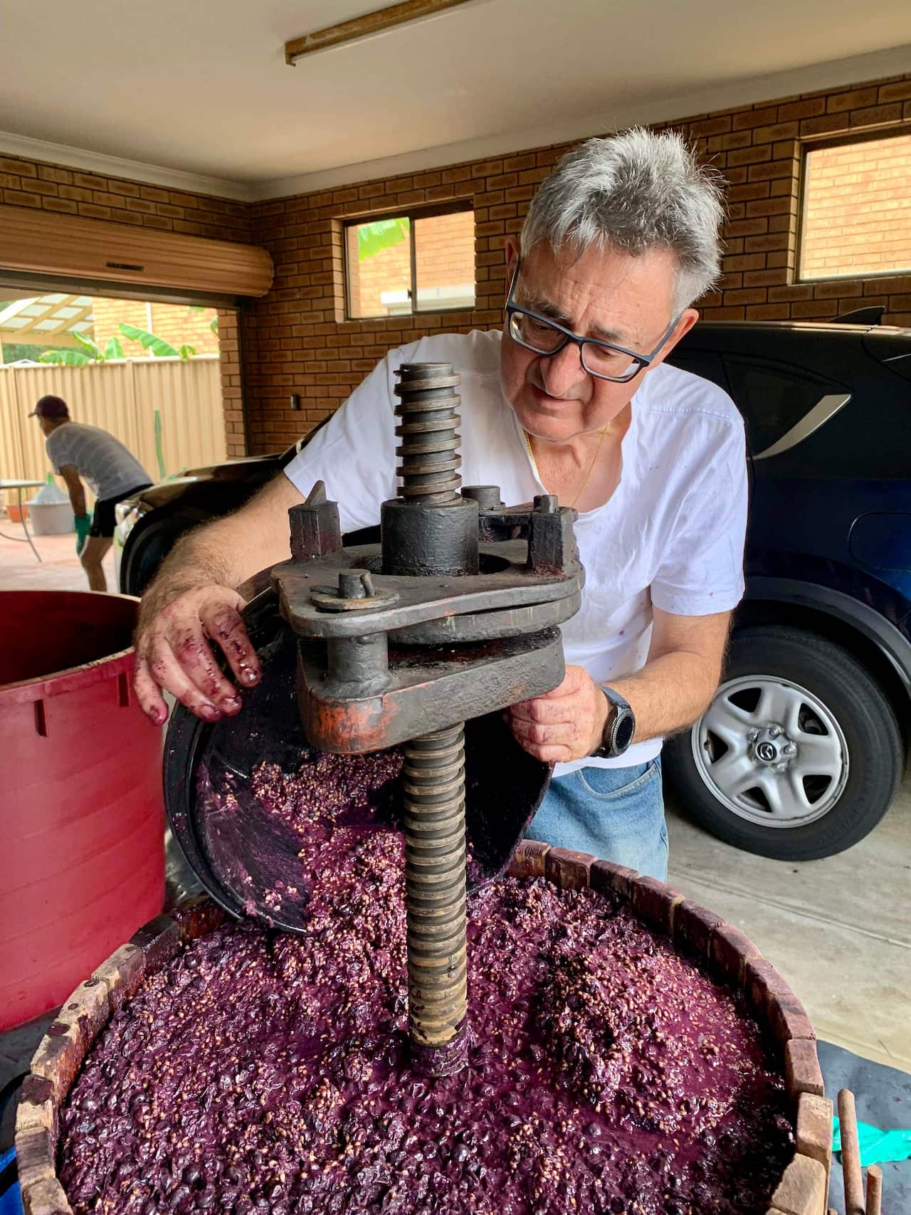 Giuseppe D'Orazio working the winepress