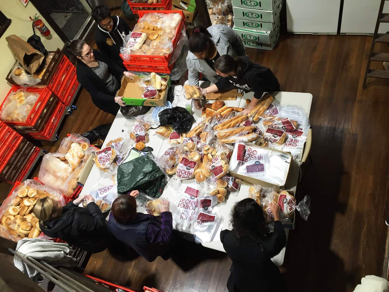 Volunteers sorting bread at the St Brigid's outreach centre in Marrickville.