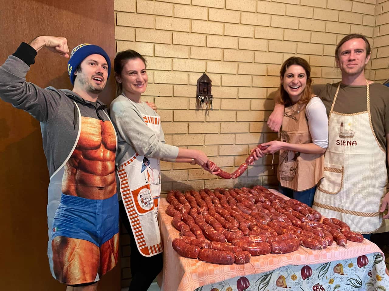 Grand-daughters Carla Nardi and Julia D'Orazio with their respective partners, Brett Nardi and Tom Lucey holding the fruits of their labour.
