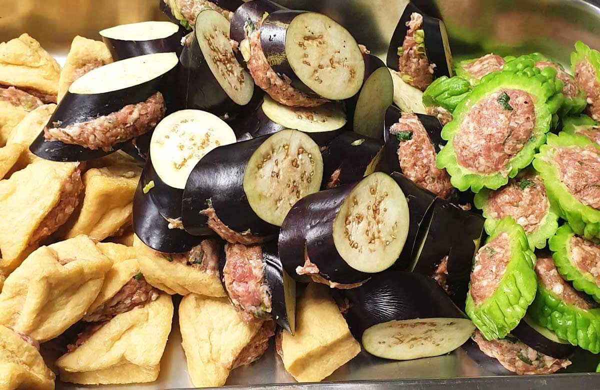 Ingredients being stuffed for the yong tau foo dish.