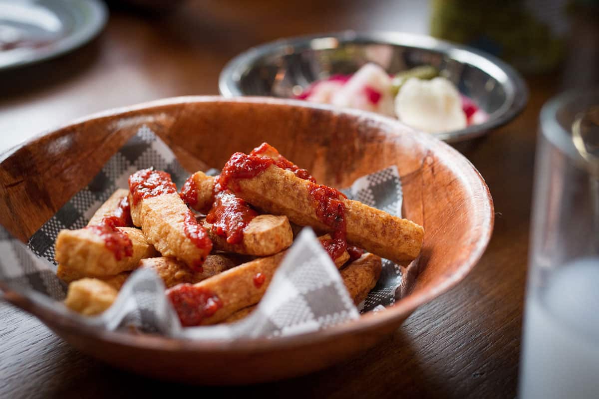 Fried haloumi strands arrive with pepper and pomegranate dipping sauce.