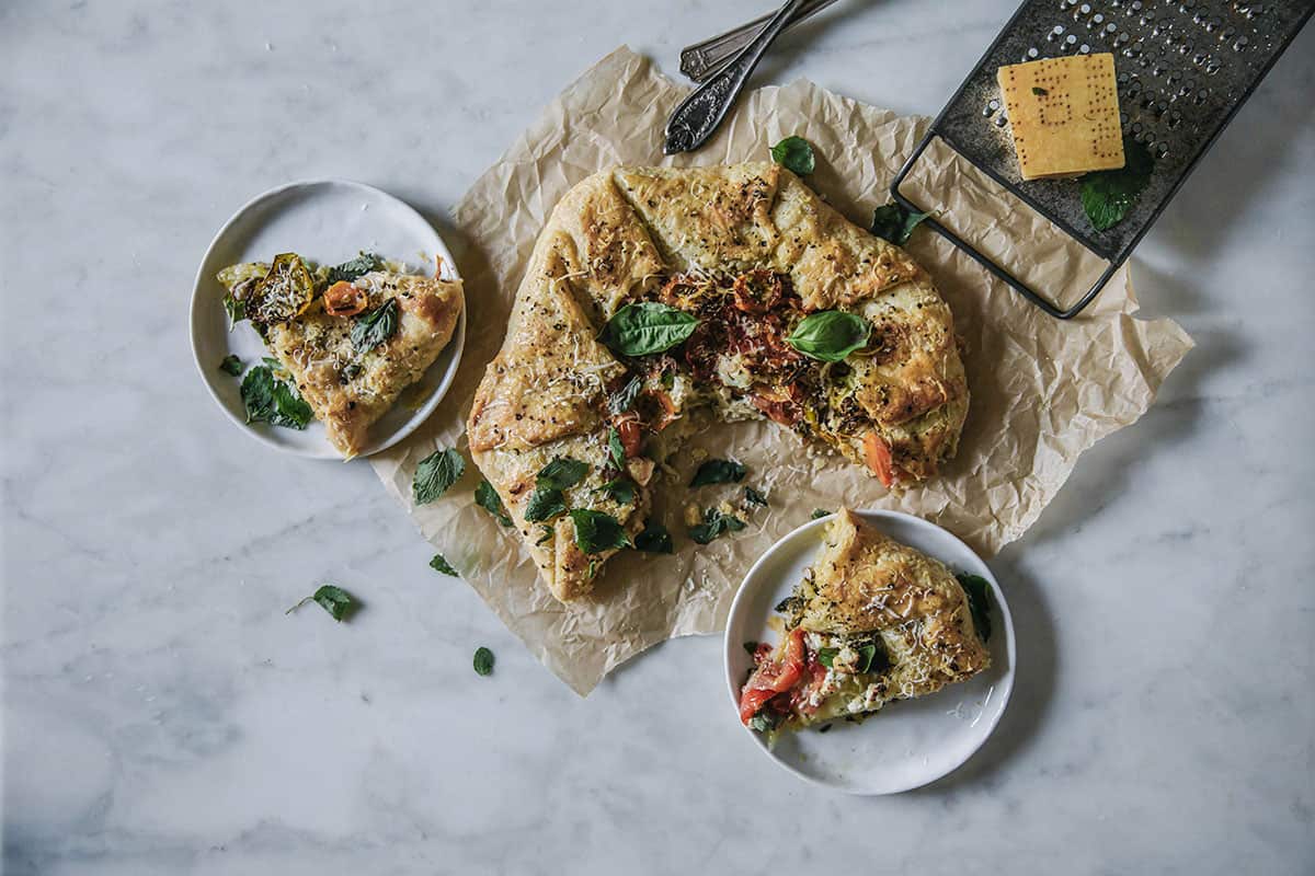 Heirloom tomato galette with lemon balm almond pesto and chevre