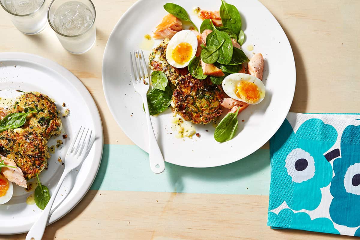 Hot smoked salmon and soft-boiled eggs on quinoa patties