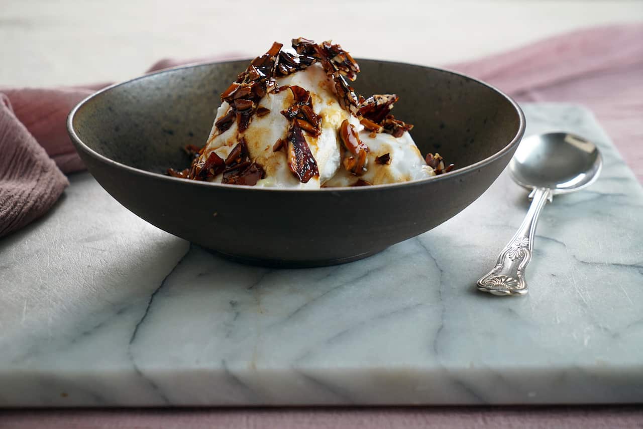 Floating islands with praline and lavender crème anglaise