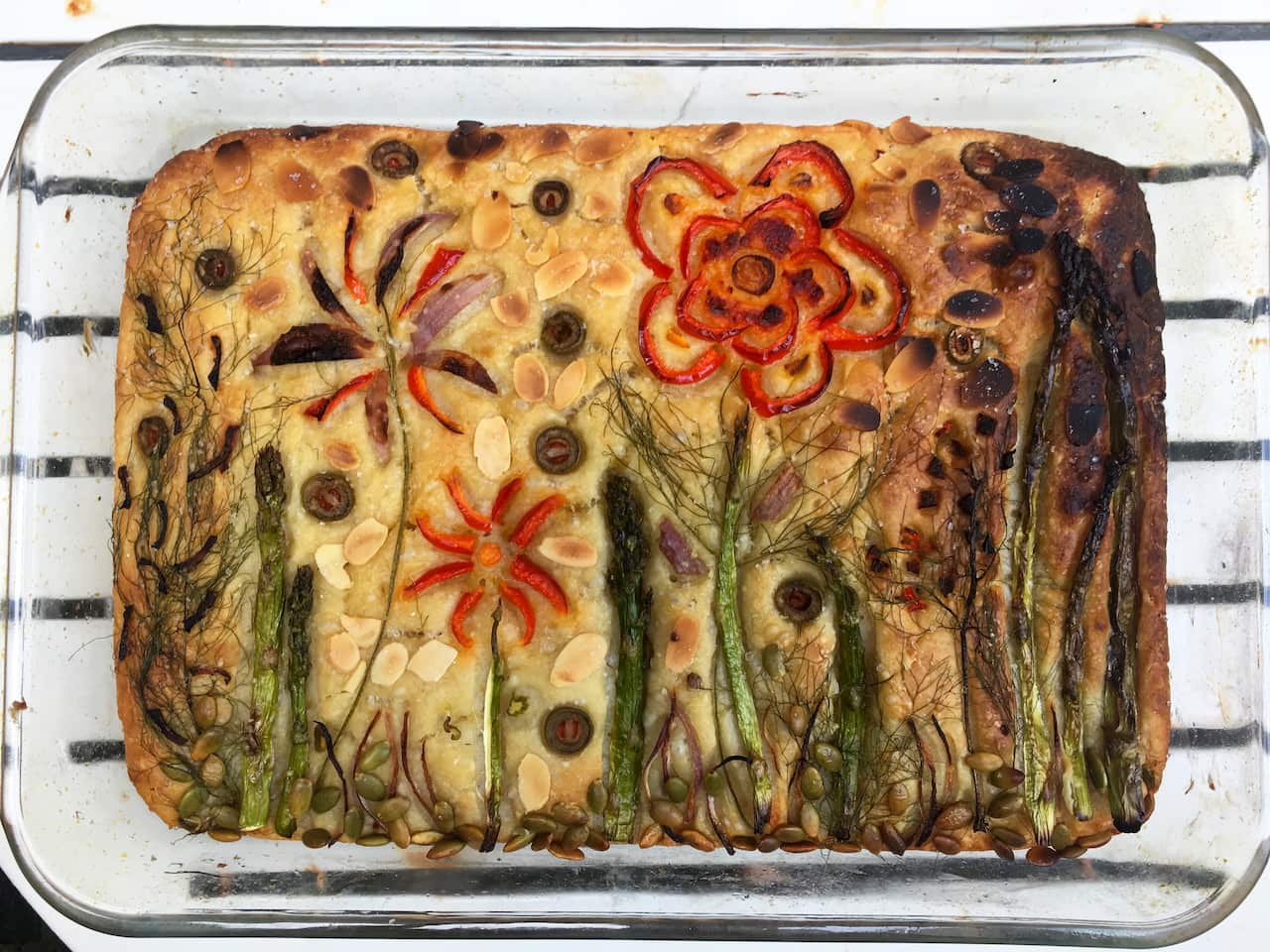 Focaccia with vegetable flowers baked