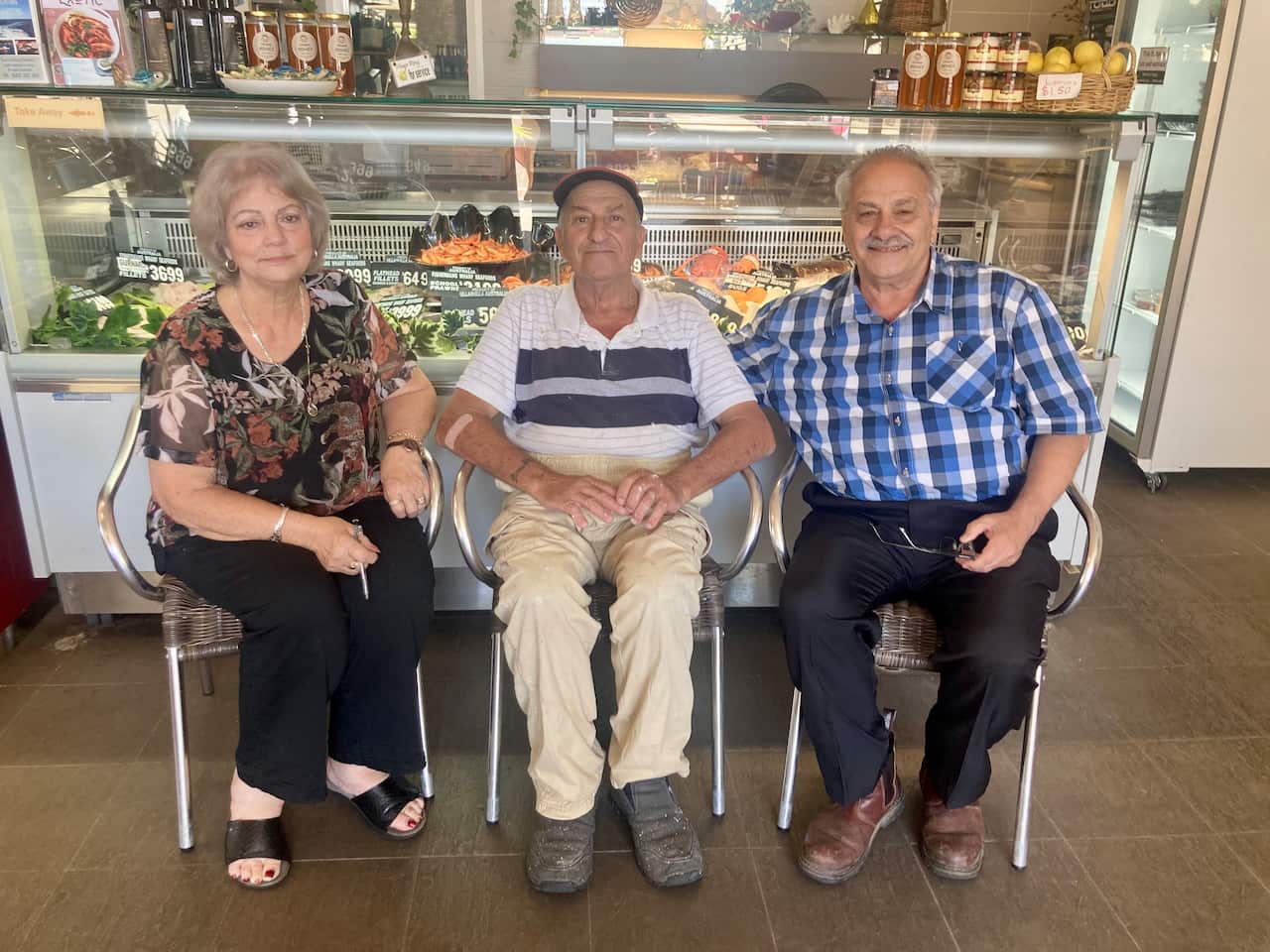 Owner of Fisherman’s Wharf Café in Ulladulla, Josi Young with her two brothers from the Puglisi family. 