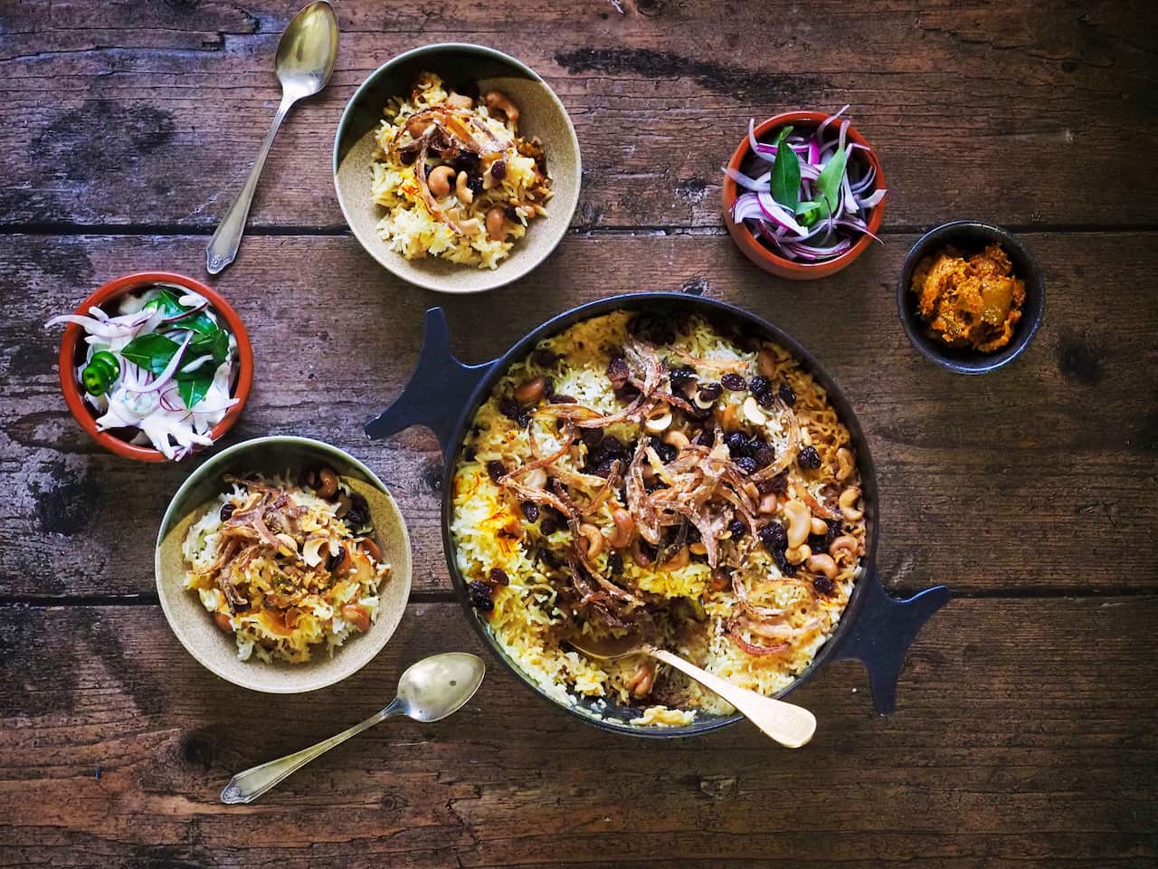 Lamb biryani served with sarma and lime pickles