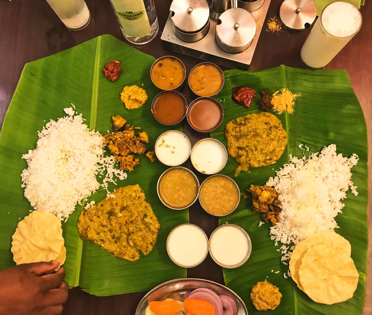 A thali presented on banana leaf.
