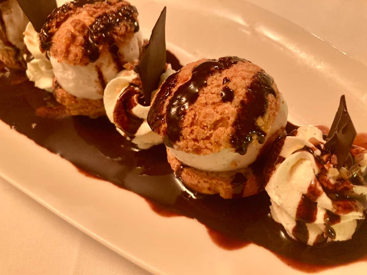 There's always room for dessert if the profiteroles are drizzled with hot chocolate.