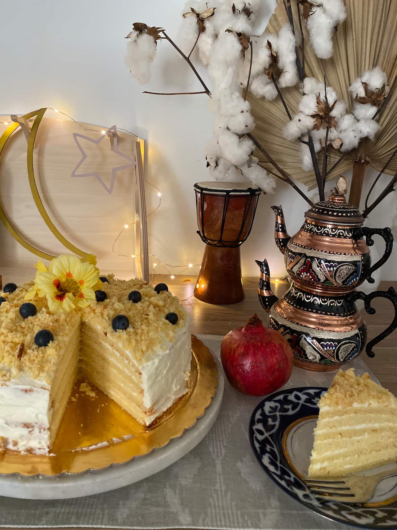 Uyghur food from past Eid al-Fitr celebrations: a layered cake (katkat) and traditional tea made of milk, cream and salt called (atkan chay).