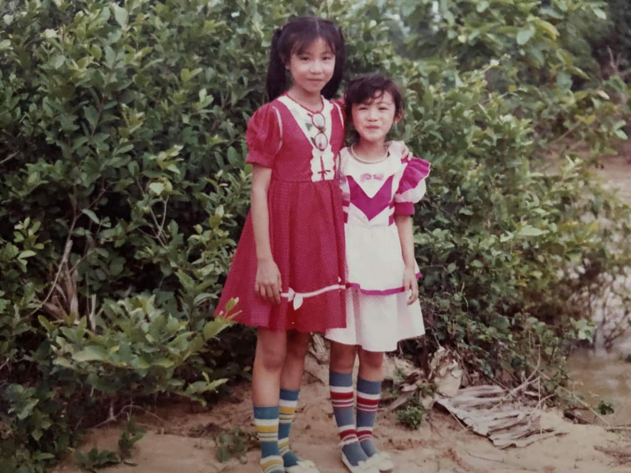Iris and her sister as children.