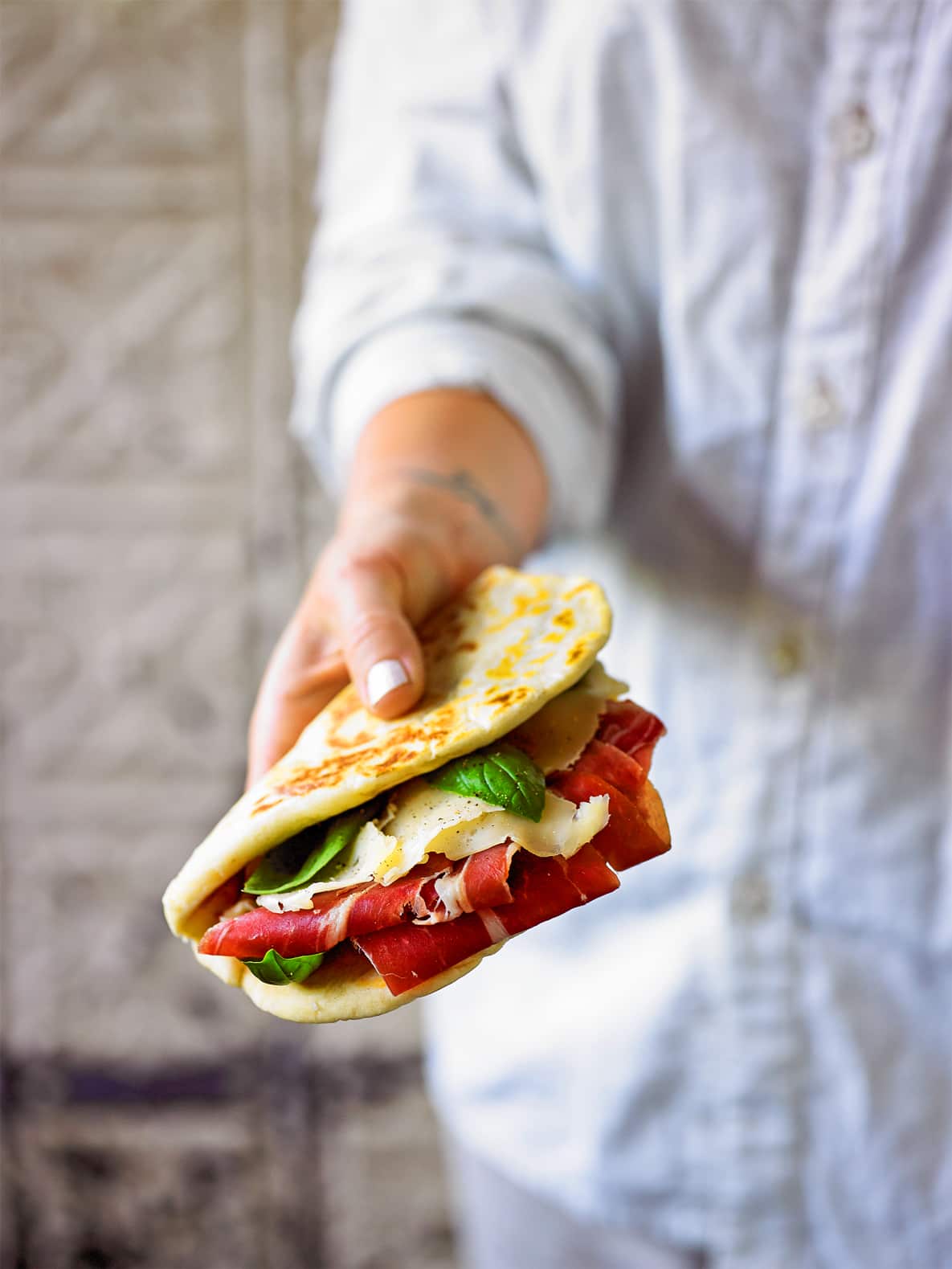 Italian flatbread with prosciutto and fontina (piadina)