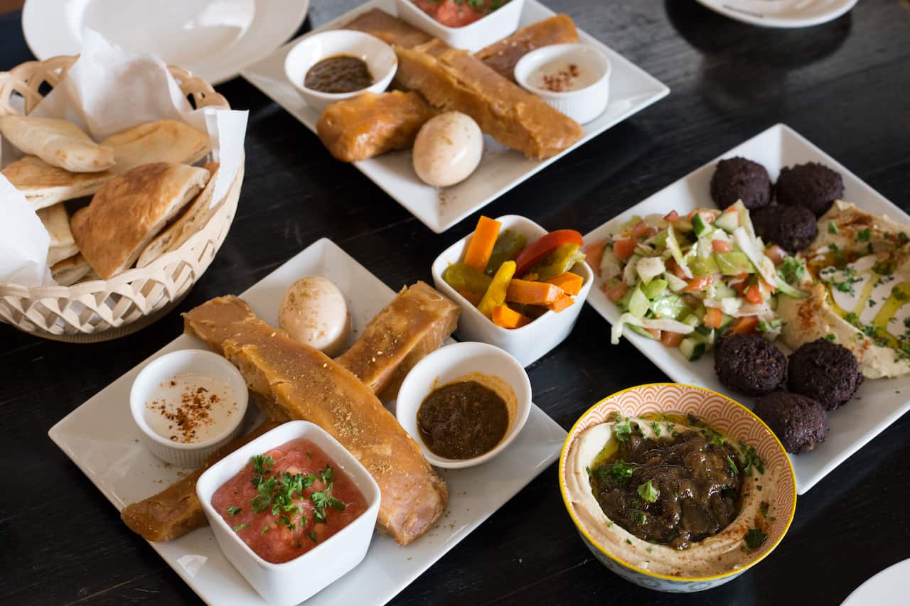 Jachnun, hummus and falafel plate at The Black Yard.