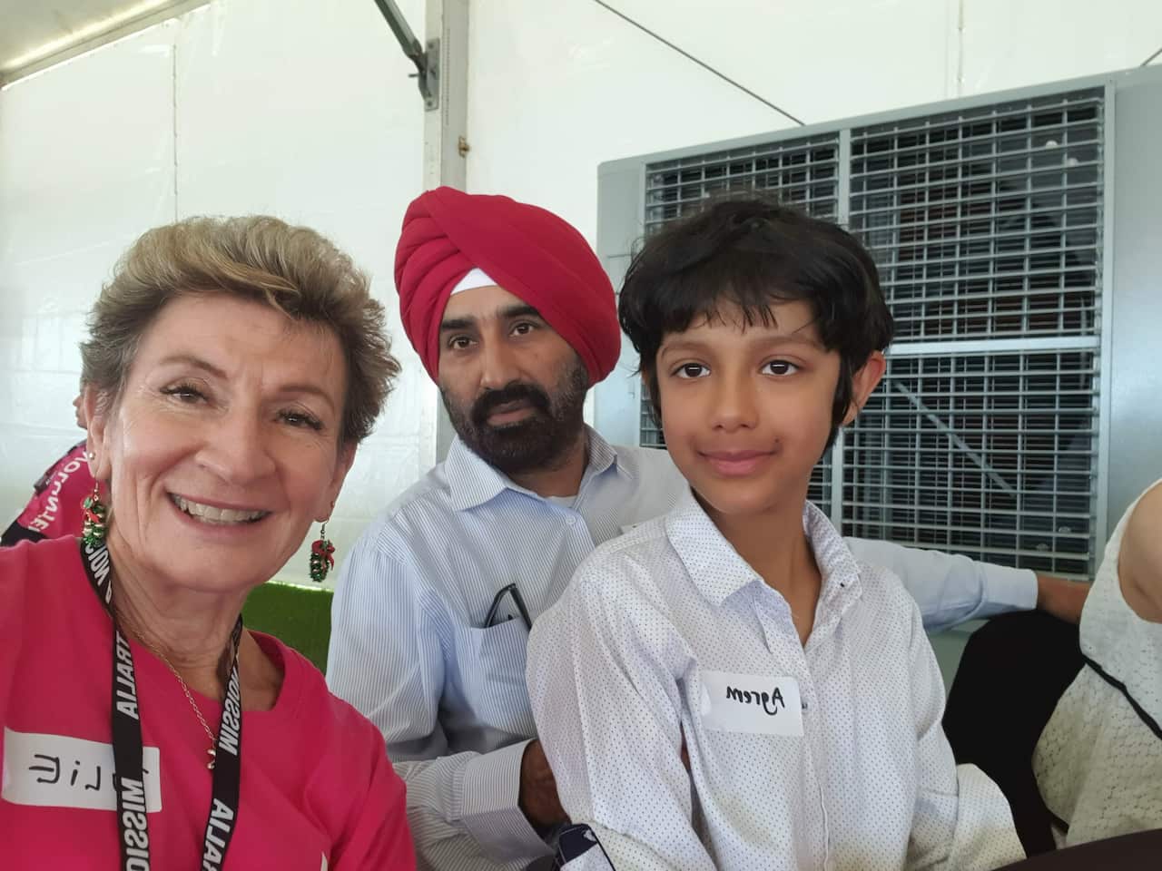 Table host, Julie Katsimbardis, with guests at last year's Christmas In the Park event. 