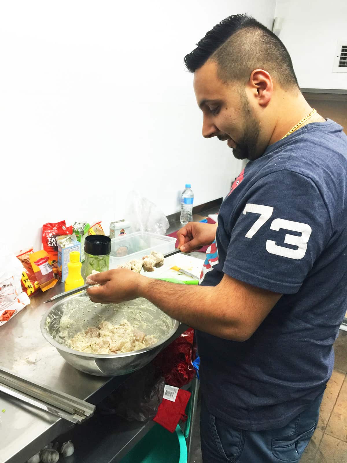 Singh prepping ingredients.