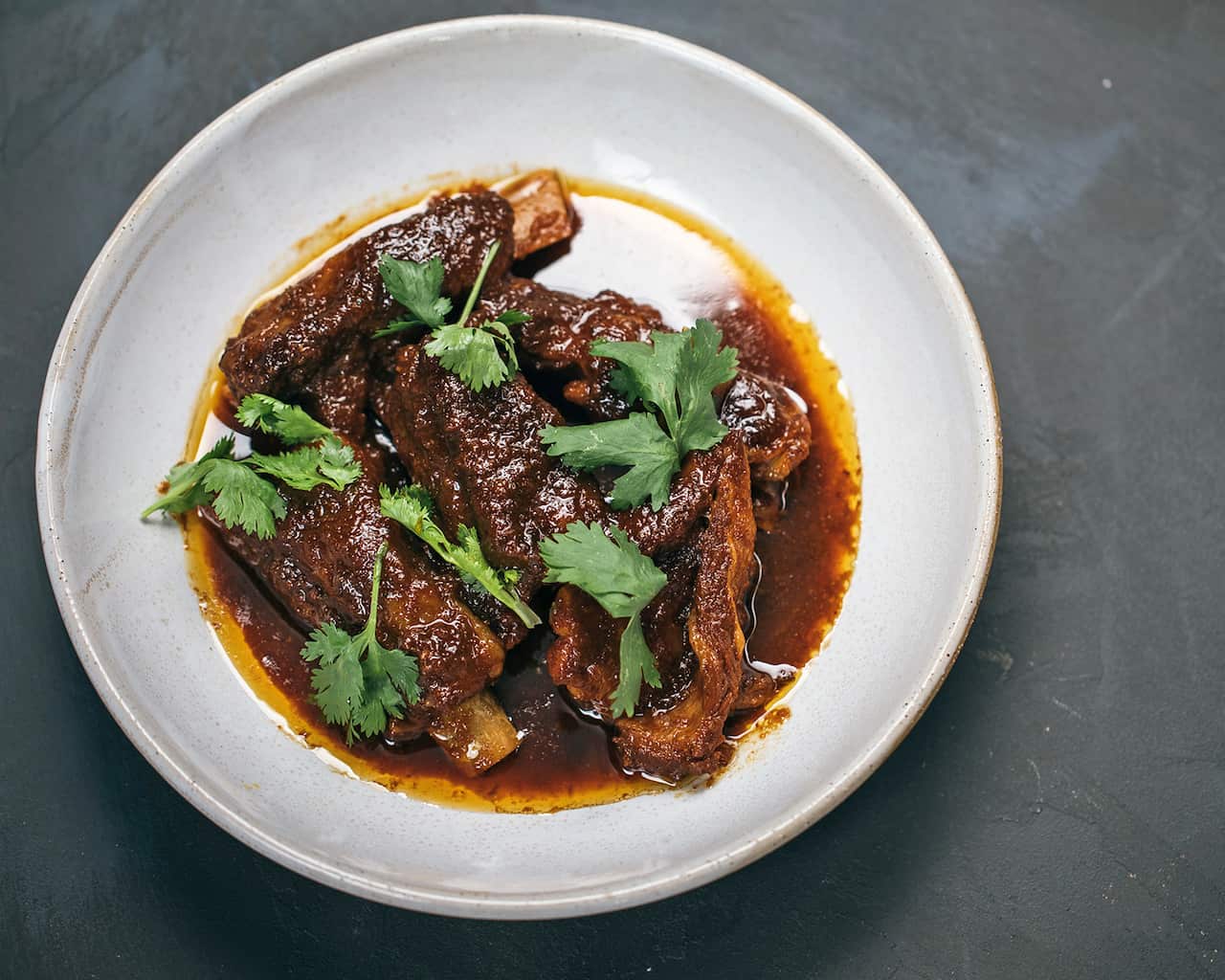 Kambing sioh (lamb ribs in tamarind and coriander gravy)