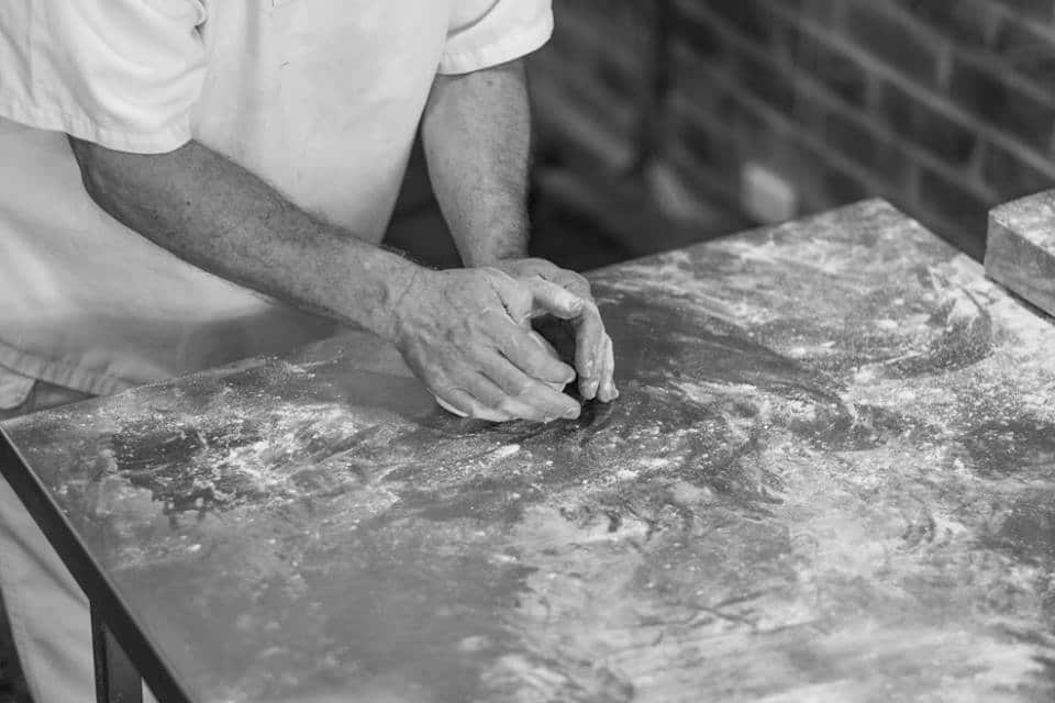 At Label Baguette, Mott rolls and shapes his baguettes and bread by hand.