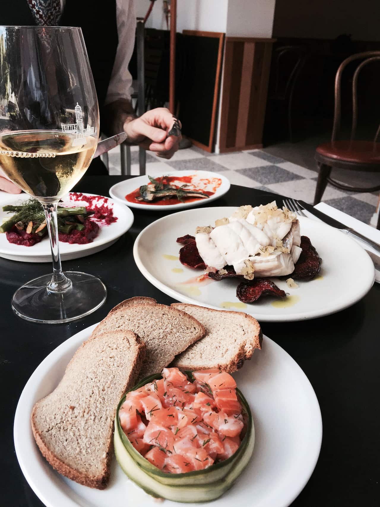 Dill and vodka salmon tartare with pickled cucumber and rye bread at Little Odessa.